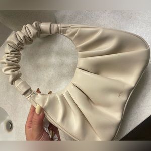 Used once- JW Pei cream purse